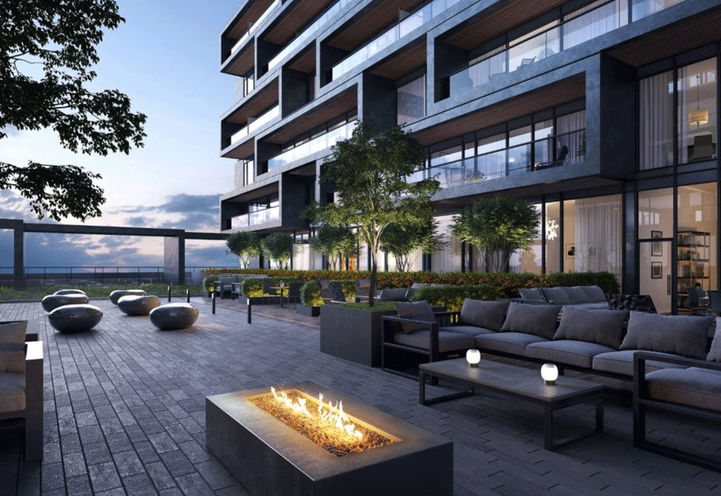 Outdoor Terrace with Seating and Fireplace at Dusk - Galleria 02