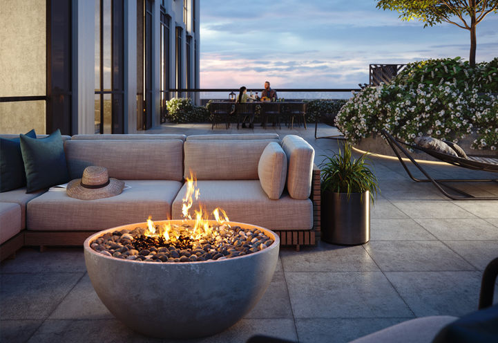 Verge Condos Rooftop Terrace with Fire Pit at Dusk