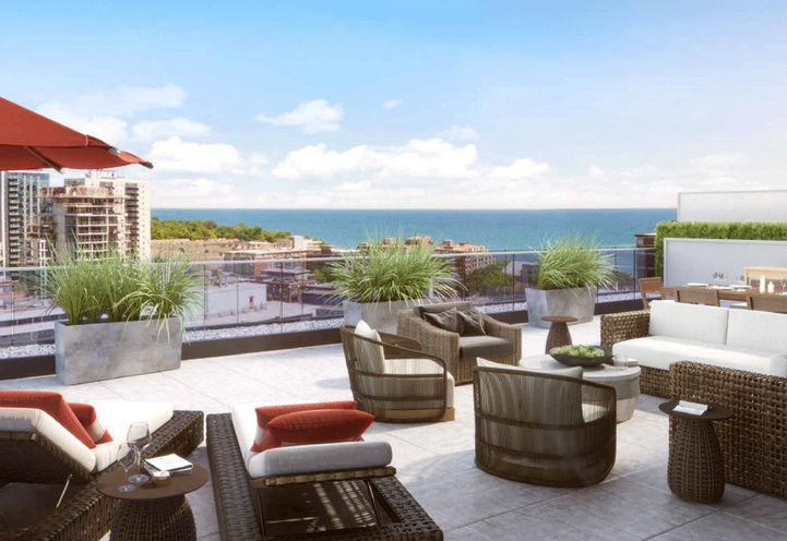 Rooftop Terrace with Seating Areas and View of the Lake