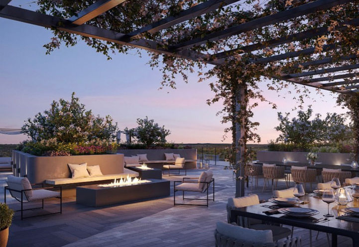 Highland Commons Condos Rooftop Terrace Dining and Lounge Area at Dusk