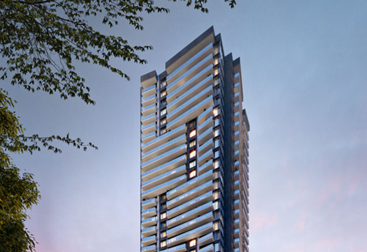 Metro Park Condos Exterior View of Upper Levels at Dusk