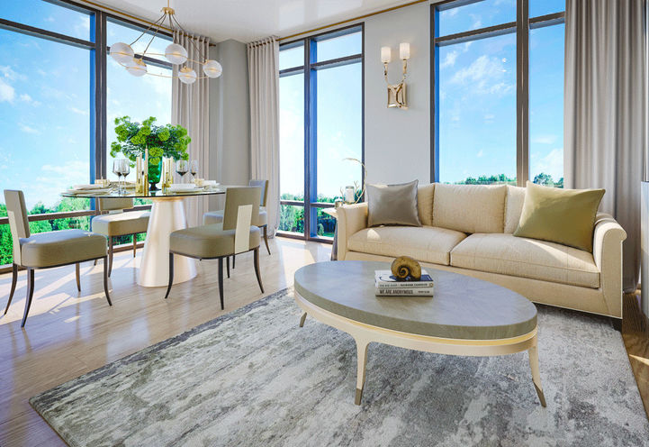 Open Living Space with Couch and Dining Table Within a 2 Bedroom Unit