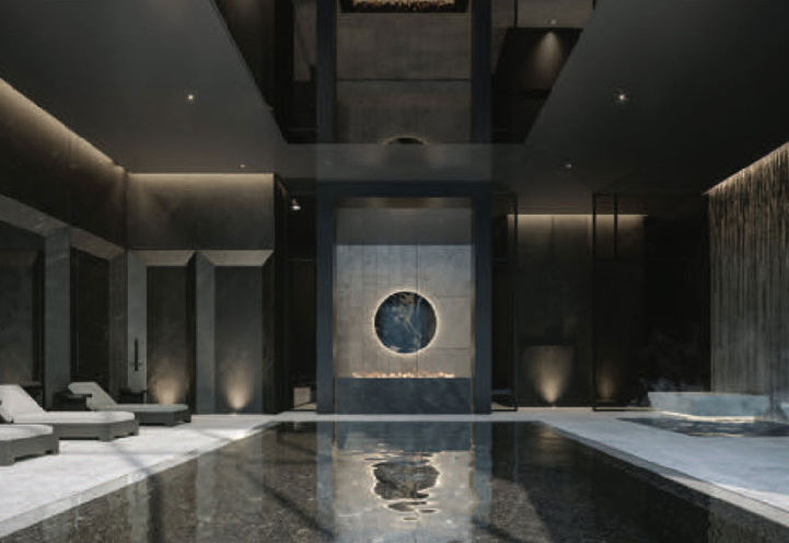 Indoor Pool with Reclining Chaise Loungers at Untitled Toronto Condos